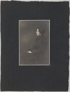 Studio portrait of a woman; photograph with a frame.