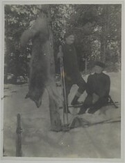 Oskari and Hannes Pero with a dead wolf in a snowy forest in Suolahti, 1918.