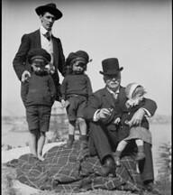 Dr Lindsay with Jean on his leg, Norman Lindsay with Jack & Ray, at Berrys Bay, ca. 1900-1912, by Lionel Lindsay