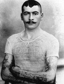 Man with tattoos circa 1900 (archive ref DDX1319-5-7)