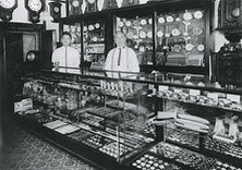 Mr. S. Edamura and his father at his watch and jewelry store on Main Street, Vancouver