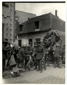 Indian Corps Headquarters Post Office. The officer seen in the foreground [Lieut Bullard] was killed the next morning by a shell, after the photograph was taken [Merville, France]. Photographer: H. D. Girdwood.