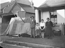 William Roberts, an original Anzac, and his family evicted from their Redfern home into the street during the Great Depression, Sydney, 28 Sep 1934 / photographer Sam Hood