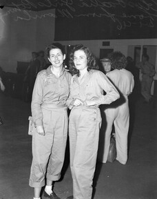 Two young women in uniform returning home from Manila, Brisbane 1946