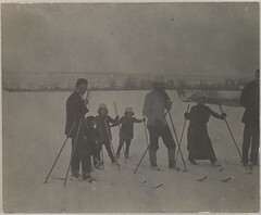 Hungarian children and adults skiing on ice.