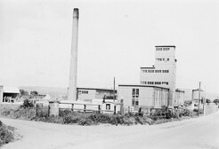 Factory building with high chimney