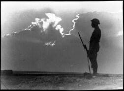 El Alamein [lone soldier on guard in silhouette]