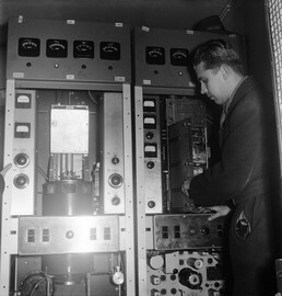 Television transmitter is being installed into the Helsinki Olympic stadium tower, 22.1.1957