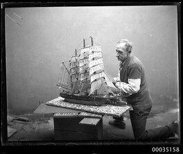 Man with a model of a fully rigged ship, 23 June 1934