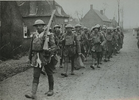 Official photograph taken on the British Western Front in France : The German offensive - Some of the gallant 55th going for a short rest after fighting hard