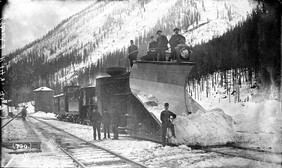 Snow plow attached to a train engine