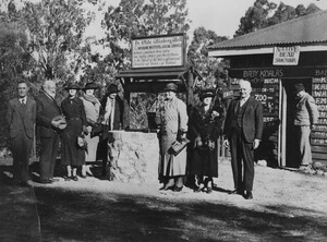 People gather around Ye Olde Wishing Well at the entrance to Lone Pine Koala Sanctuary, Fig Tree Pocket, ca. 1936