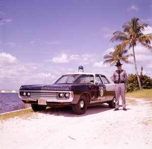 Florida Marine Patrol officer with his vehicle