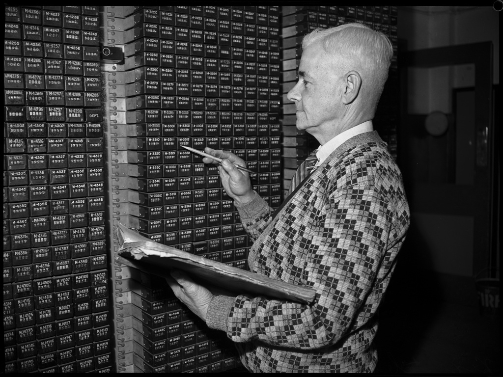 Portrait of a man in checked cardigan, Sydney telephone exchange, August 1946