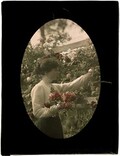 Zoe Gullick with roses in Gullick family garden, Killara, NSW, c.1909