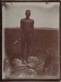 â€Homo Victorâ€. A victorious man preparing animal hide.