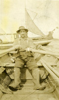 Hugh McInnis rowing in Sea Otter Cove