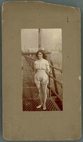 Photograph of Beatrice Kerr standing on a pier