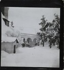 South-west view of TarvaspÃ¤Ã¤ during the winter, featuring the building's west-facing roof and archway