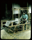 Weaving (silk) on hand loom.