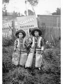 Two children, with poster advertising "Careers" which will be showing at the New Strand Theatre, Liverpool Street, Hobart 1930