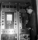 Television transmitter is being installed into the Helsinki Olympic stadium tower, 22.1.1957