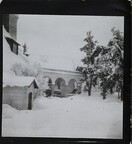 South-west view of TarvaspÃ¤Ã¤ during the winter, featuring the building's west-facing roof and archway