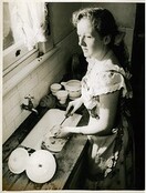 Maree Austin washes up during the run of "White sheep of the family", 1953