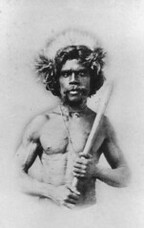 Studio portrait of a man holding a club in the Toowoomba District, 1869