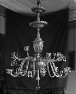 The Crystal chandeliers light up the paintings on the wall