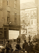 "Street scene with advertising hoardings" but where? Corner of Summerhill and Langrishe Place!