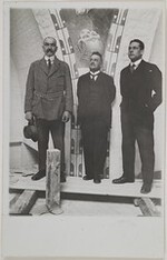 Akseli Gallen-Kallela (on the left), U.T. Sirelius and Jorma Gallen-Kallela in front of Ilmarinen Ploughing the Viper-field, one of the Kalevala cupola frescoes they were painting in the National Museum of Finland, 1928.
