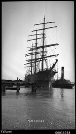 Three-masted clipper YALLAROI at a wharf with a tugboat, 1906-1923