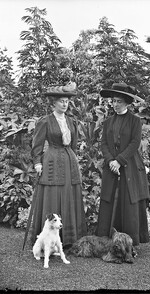 Two ladies with elegant hats and two dog - Yeehaw!