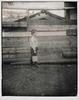 A boy holding a bucket, New York