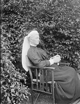 Augusta Caroline Dillon seated in Clonbrock garden