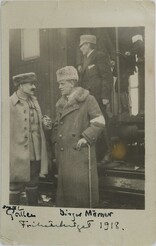 Akseli Gallen-Kallela and Count Birger MÃ¶rner standing next to a train, possibly in SeinÃ¤joki or Vaasa