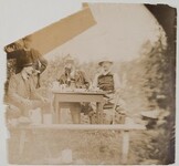 Axel GallÃ©n (on the left) sitting  with G. A. Serlachius and Louis Sparre in a garden in Keuruu, 1889.
