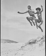 Acrobatics at the beach by two Tivoli stars, December 1951.