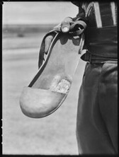 Metal shoe cover worn by speedway cyclist, 9 February 1946, photo by Ray Olson