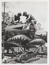 Allied airfield crew working on Lockheed P-38 fighter planes, New Guinea, c. 1944
