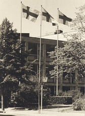 Flying flags in front of the main building