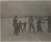 Hungarian children and adults skiing on ice.