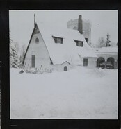 Winter-time view of TarvaspÃ¤Ã¤, photographed from the south-west. The picture features the building's roofs and its characteristic central tower and entrance archway