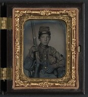 [Sergeant William T. Biedler, 16 years old, of Company C, Mosby's Virginia Cavalry Regiment with musket] (LOC)