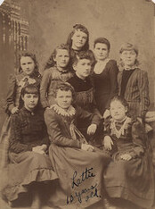 Portrait of teacher and students, 1857