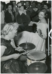 June Howarth of Canterbury and Ray Shart of Bankstown dance to the band with drummer Peg Clark of Blackheath, on the ocean cruise to Broken Bay, South Steyne, December 1953 / Australian Women's Weekly photograph