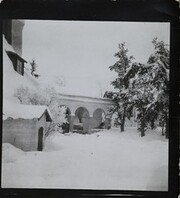 South-west view of TarvaspÃ¤Ã¤ during the winter, featuring the building's west-facing roof and archway
