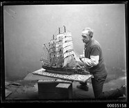 Man with a model of a fully rigged ship, 23 June 1934