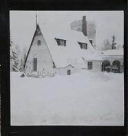 Winter-time view of TarvaspÃ¤Ã¤, photographed from the south-west. The picture features the building's roofs and its characteristic central tower and entrance archway